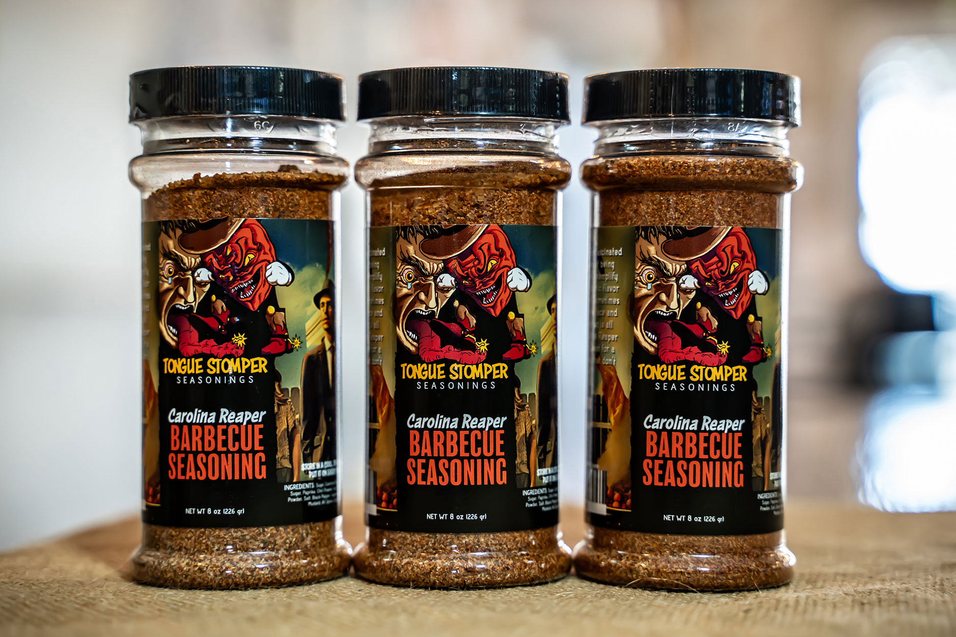 Tongue Stomper grill seasonings in Original and Carolina Reaper flavors, perfect for proteins, vegetables, and even Bloody Mary cocktails.